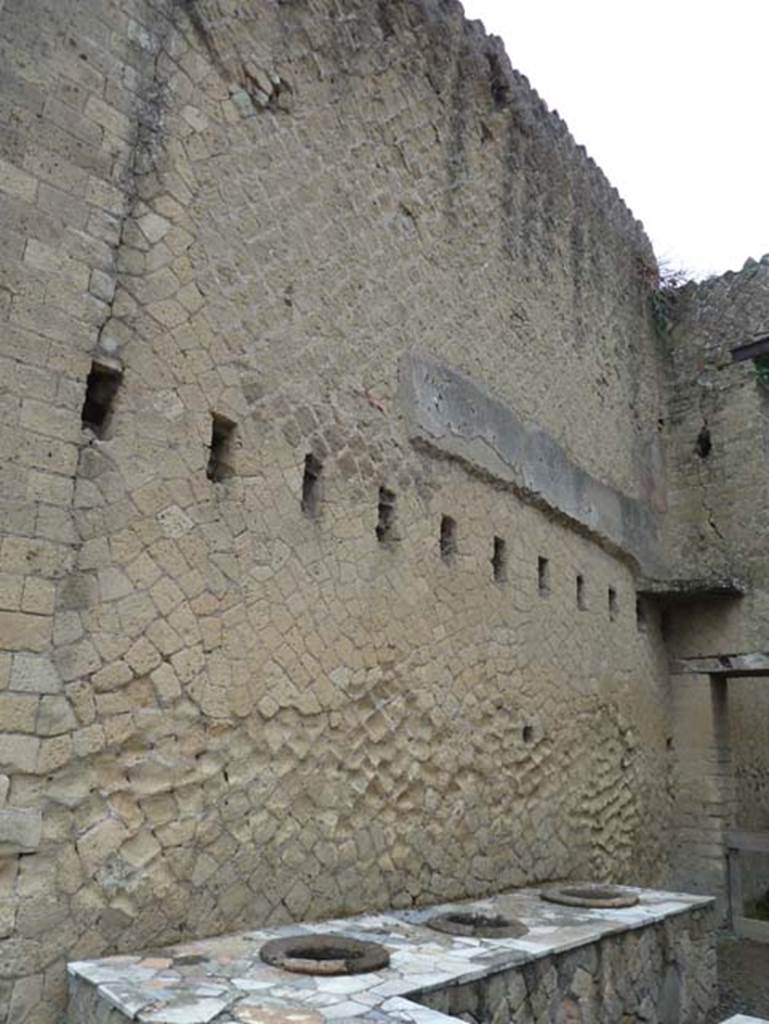 Ins. Orientalis II.6, Herculaneum. September 2015. Looking towards north wall with holes for support beams for an upper floor. On the right, in the north-east corner are the remains of mezzanine floor, as reconstructed by Maiuri.